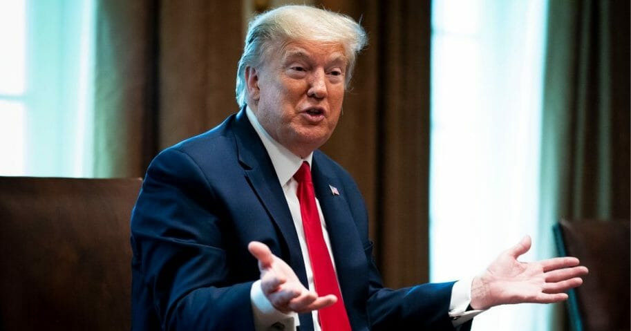 President Donald Trump speaks during a meeting with recovered COVID-19 patients in the Cabinet Room at the White House on April 14, 2020.